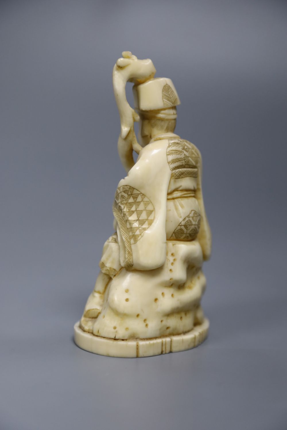 A Japanese walrus ivory figure of an immortal, height 11cm